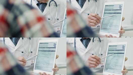 医生在平板电脑上显示文件高清在线视频素材下载