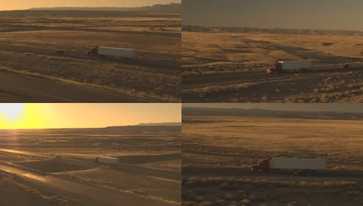空中汽车在公路上行驶，在日落时超过乡村公路上行驶的卡车高清在线视频素材下载