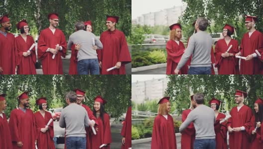 骄傲的父母在大学校园的背景下祝贺学生毕业，与他们握手拥抱，年轻人在交谈和微笑。高清在线视频素材下载