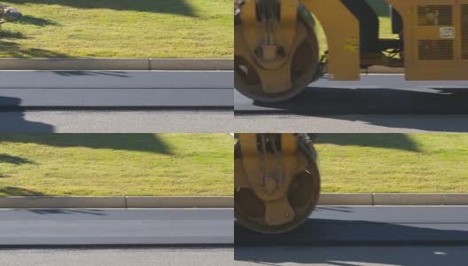 沥青压路机使路面光滑，向右行驶高清在线视频素材下载
