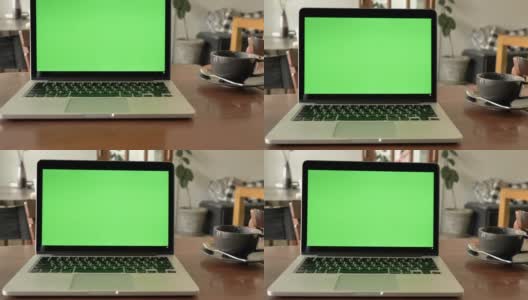 家中书桌上的笔记本电脑显示绿色色度键屏场景。背景中的技术，技术背景的概念和生活中的日子对象高清在线视频素材下载