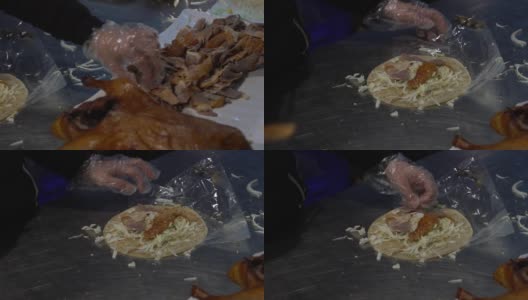 慢镜头亚洲女人做美味的鸭子与中国煎饼卷高清在线视频素材下载