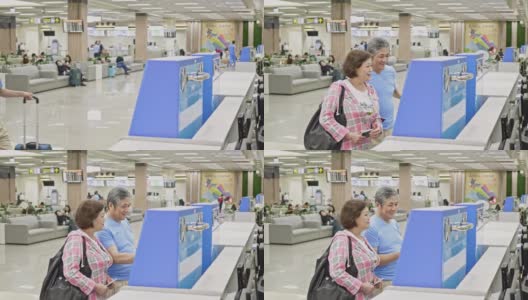 一对亚洲老年夫妇在机场使用自动值机高清在线视频素材下载