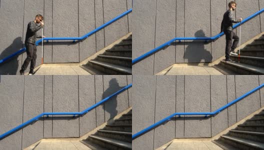 盲人独自拿着手杖爬楼梯的肖像。障碍,自治,高清在线视频素材下载