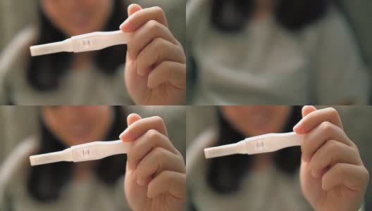 妇女的手妊娠测试呈阳性高清在线视频素材下载