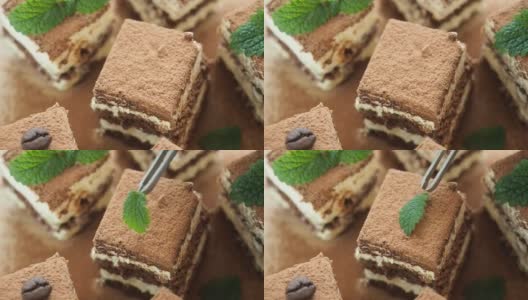 糕点师用新鲜的薄荷叶装饰蛋糕高清在线视频素材下载