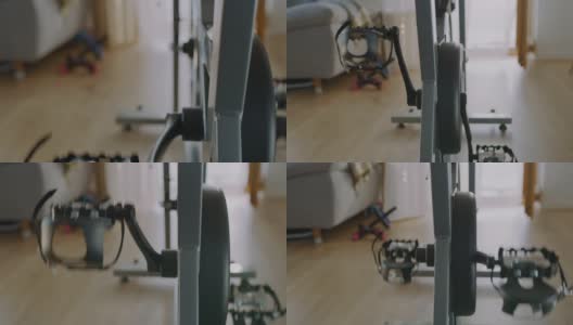 SLO MO踏板在家里的健身自行车上旋转高清在线视频素材下载