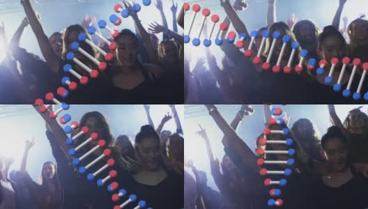 一群在音乐会上一起跳舞的人的Dna结构旋转高清在线视频素材下载
