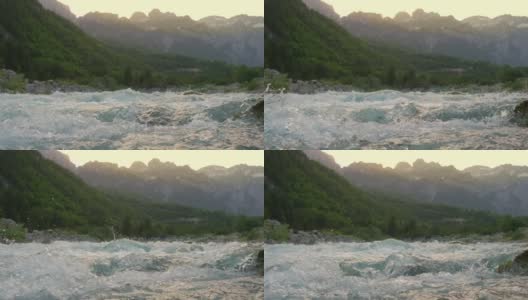 湍急的山河水与雄伟的岩石山脉在背景高清在线视频素材下载
