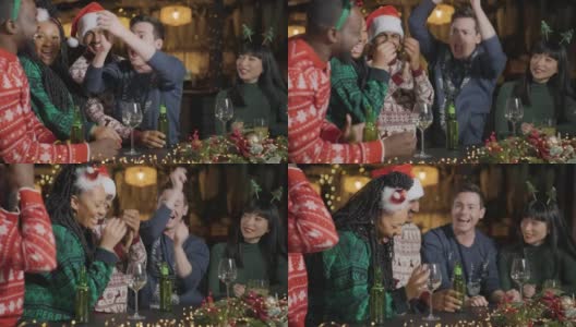 跟踪拍摄的一个醉汉和他的朋友在圣诞节庆祝在酒吧高清在线视频素材下载