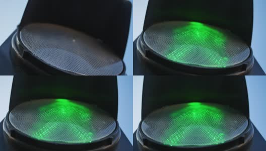 特写人行横道交通灯，红灯转绿灯高清在线视频素材下载