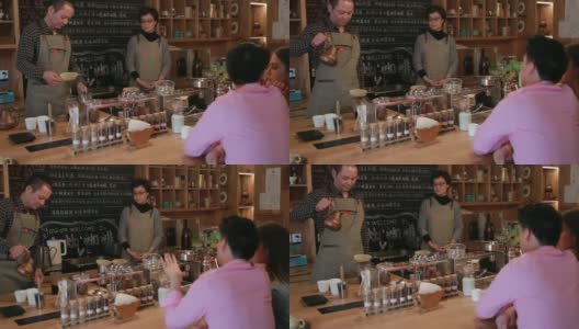 在自助餐厅煮咖啡的成熟男人高清在线视频素材下载
