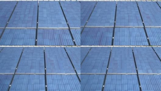 在阳光明媚的一天，屋顶上的光伏太阳能电池在太阳能板上滑行，产生清洁的可再生能源高清在线视频素材下载