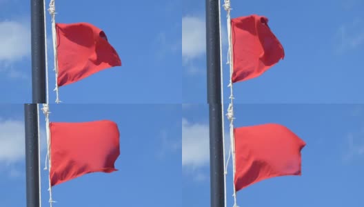 有风、有暴风雨的日子，海滩上挂着红色警告旗高清在线视频素材下载