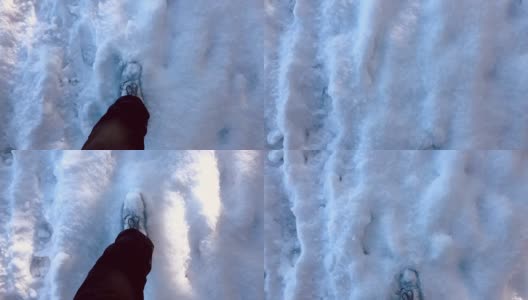 穿着靴子穿过厚厚的积雪的男性高清在线视频素材下载