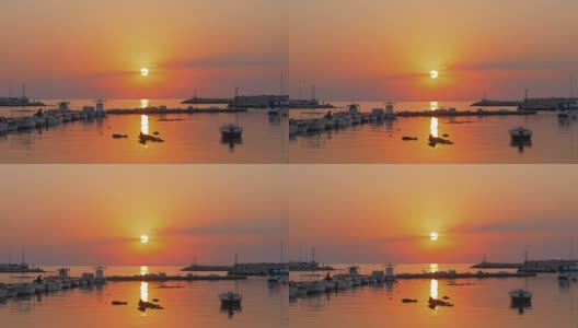 夕阳下的小港湾和飞翔的海鸥高清在线视频素材下载