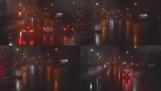 夜晚的道路。从赛道上的车里射击。汽车前进。下雨了，雨滴落在左边的玻璃上。从一辆双层巴士上射击。4л高清在线视频素材下载