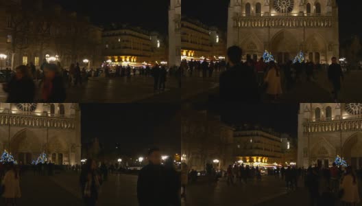 法国夜间巴黎圣母院广场游客拥挤，全景4k高清在线视频素材下载