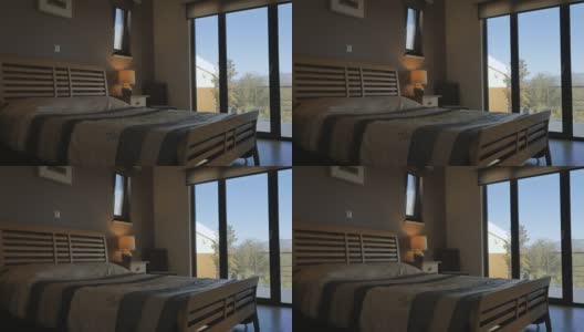 现代化的卧室，全景窗户和美丽的景色高清在线视频素材下载