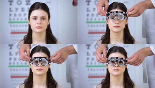 眼科医生将光学试验架放在女孩视力矫正屈光度测量上高清在线视频素材下载