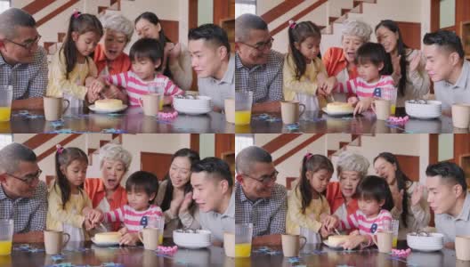 多代同堂的中国家庭在家为孩子庆祝生日高清在线视频素材下载