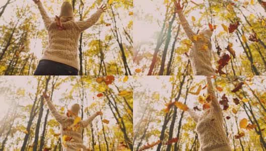 MS超级慢镜头无忧无虑的年轻女子纺纱在飘落的金秋树叶在森林高清在线视频素材下载