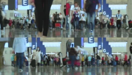 人群带着行李在国际机场行走的时间流逝。高清在线视频素材下载