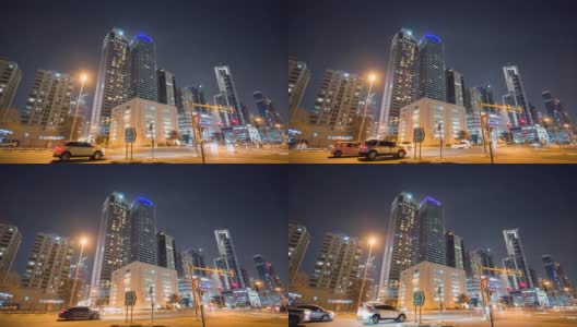 迪拜的夜市街道上有道路交通和摩天大楼。间隔拍摄高清在线视频素材下载