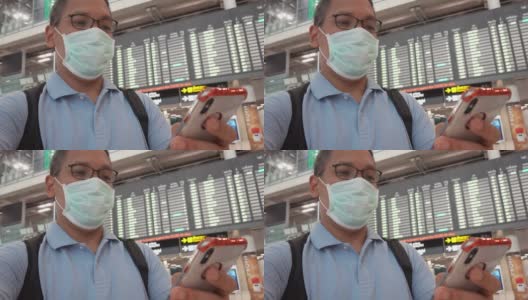 一名男子在机场候机楼戴口罩高清在线视频素材下载