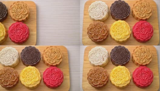 木制盘子上五颜六色的中国混合风味月饼高清在线视频素材下载