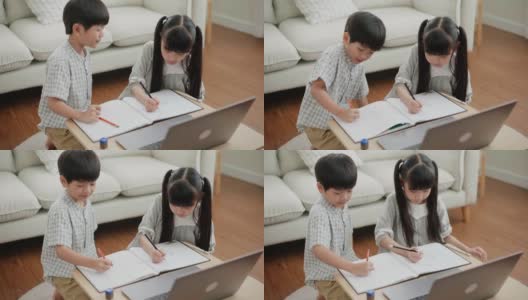 两个小孩子在客厅里画画高清在线视频素材下载