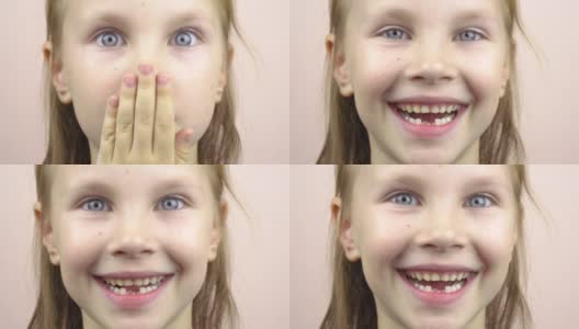 一个小女孩的脸部特写，她的嘴露出掉下来的乳牙，做鬼脸。4k高清在线视频素材下载