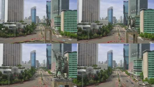 雅加达,印度尼西亚。2017年12月28日:印尼酒店环岛的塞拉马特大唐纪念碑或欢迎纪念碑和苏迪曼街鸟瞰图。拍摄分辨率为4k高清在线视频素材下载