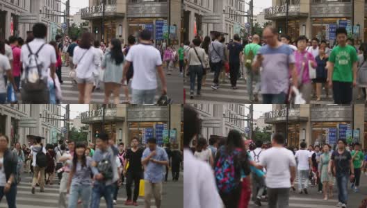 行人在城市街道斑马线上行走，实时。高清在线视频素材下载