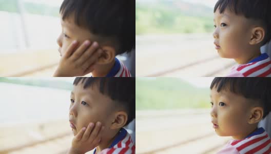 男孩看着窗外的地铁车厢高清在线视频素材下载