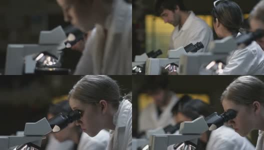 在生物实验室使用显微镜的学生高清在线视频素材下载