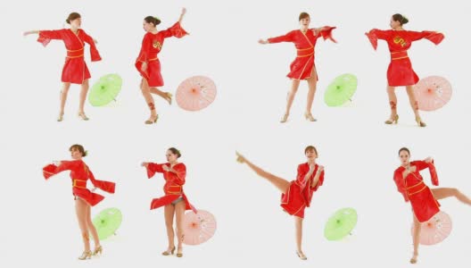 两个欧洲女孩，穿着中国服装在雨伞间跳舞。高清在线视频素材下载