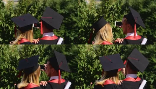 一对快乐的毕业生用智能手机拍摄毕业典礼视频高清在线视频素材下载