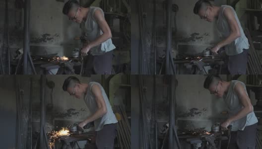 亚洲铁匠在他的铁匠铺里打磨高清在线视频素材下载