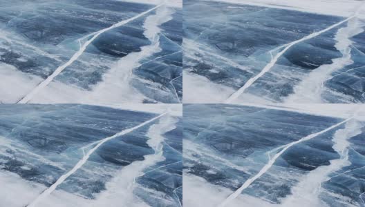 风吹着雪粒在贝加尔湖结冰的水面上移动高清在线视频素材下载