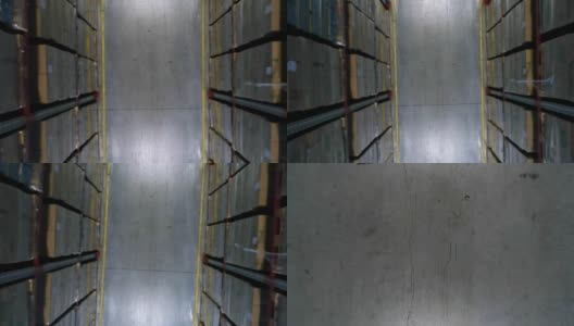 在一个仓库里，摄像机吊在纸板箱的架子上高清在线视频素材下载