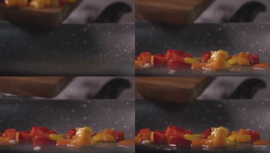 将切碎的甜椒放入平底锅中，慢镜头，240帧/秒高清在线视频素材下载