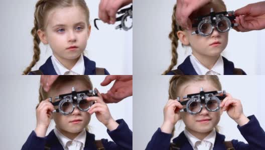 男眼科医生检查女学生的视力，带着荧光镜微笑的孩子，吃药高清在线视频素材下载