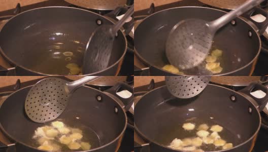 用热油锅煎炸薯条。高清在线视频素材下载