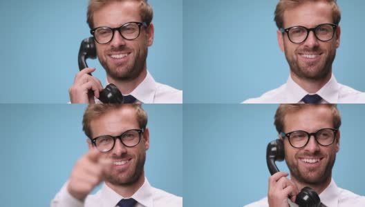一个微笑的商人拿起电话的特写，交谈，大笑，挂起和指着蓝色背景的相机高清在线视频素材下载