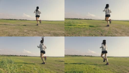 运动员跑步亚洲女运动员在日落日出。高清在线视频素材下载