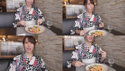 一名日本女子为了拍视频在一家法国餐厅吃午餐高清在线视频素材下载
