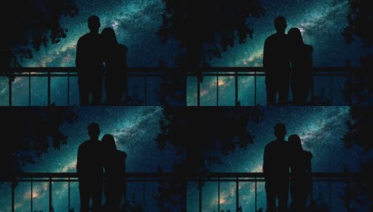 这对情侣站在树旁，映衬着繁星点点的天空。时间流逝高清在线视频素材下载