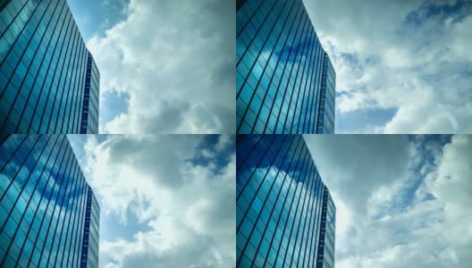 天空与移动的云反射在办公大楼的窗户玻璃上高清在线视频素材下载