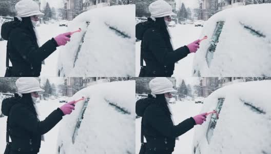 妇女清洁和准备汽车为困难的冬天在城市驾驶高清在线视频素材下载